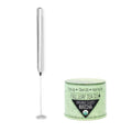 A Matcha Frother next to a tin of Organic Sweet Matcha.