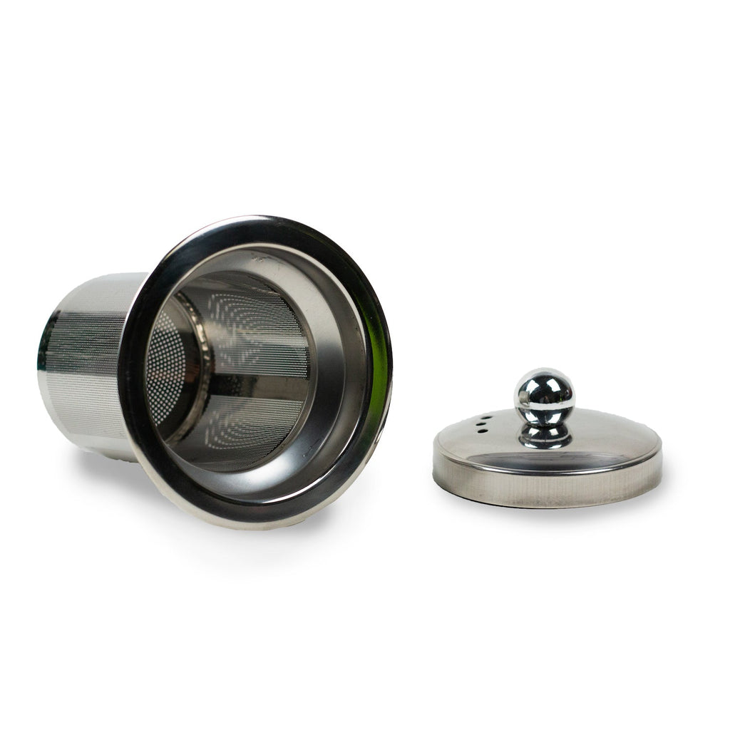 A Stainless Steel Infuser Basket on its side next to a lid.