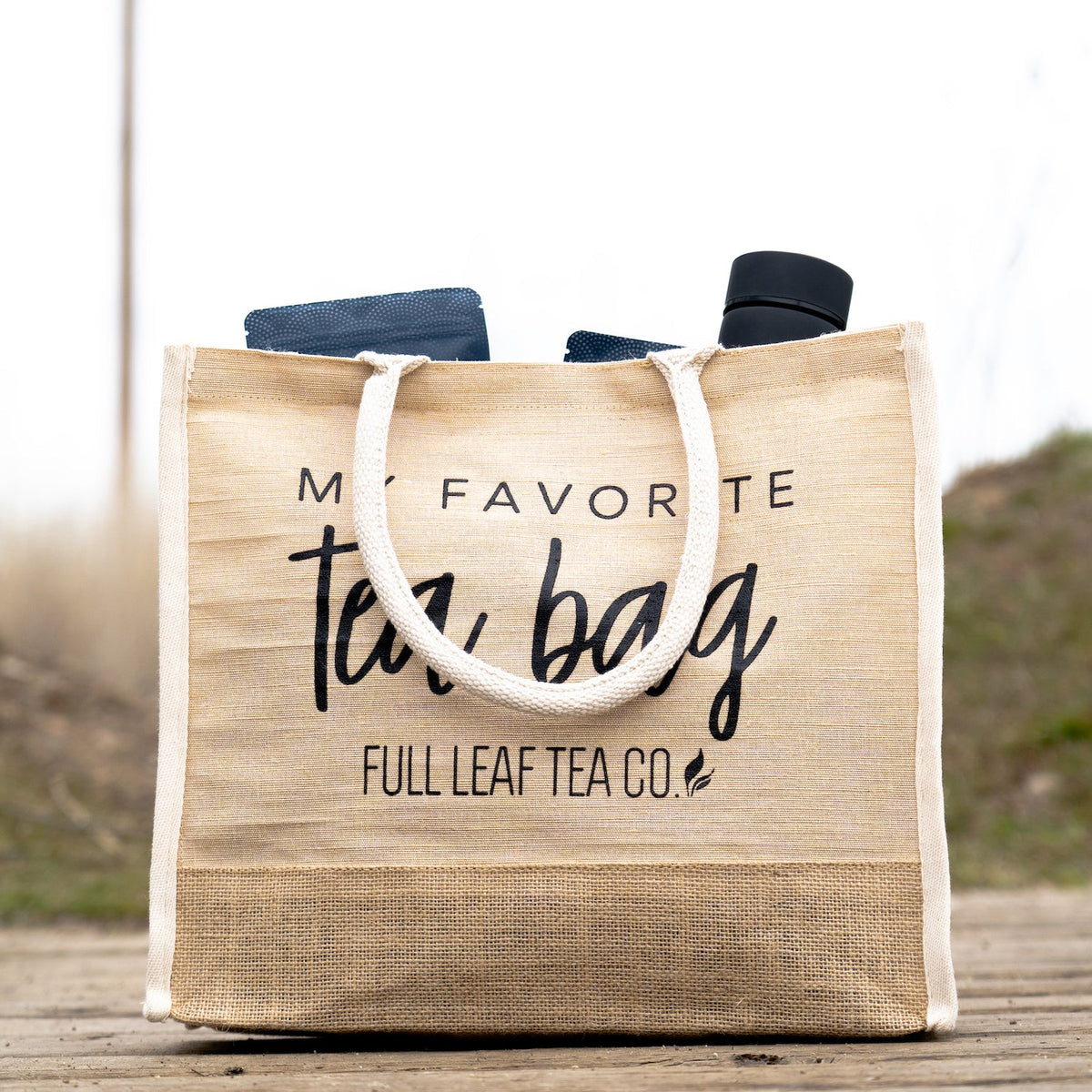 A "My Favorite Tea Bag" Tote Bag filled with some Full Leaf Tea Company items.