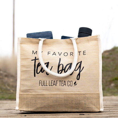 A "My Favorite Tea Bag" Tote Bag filled with some Full Leaf Tea Company items.